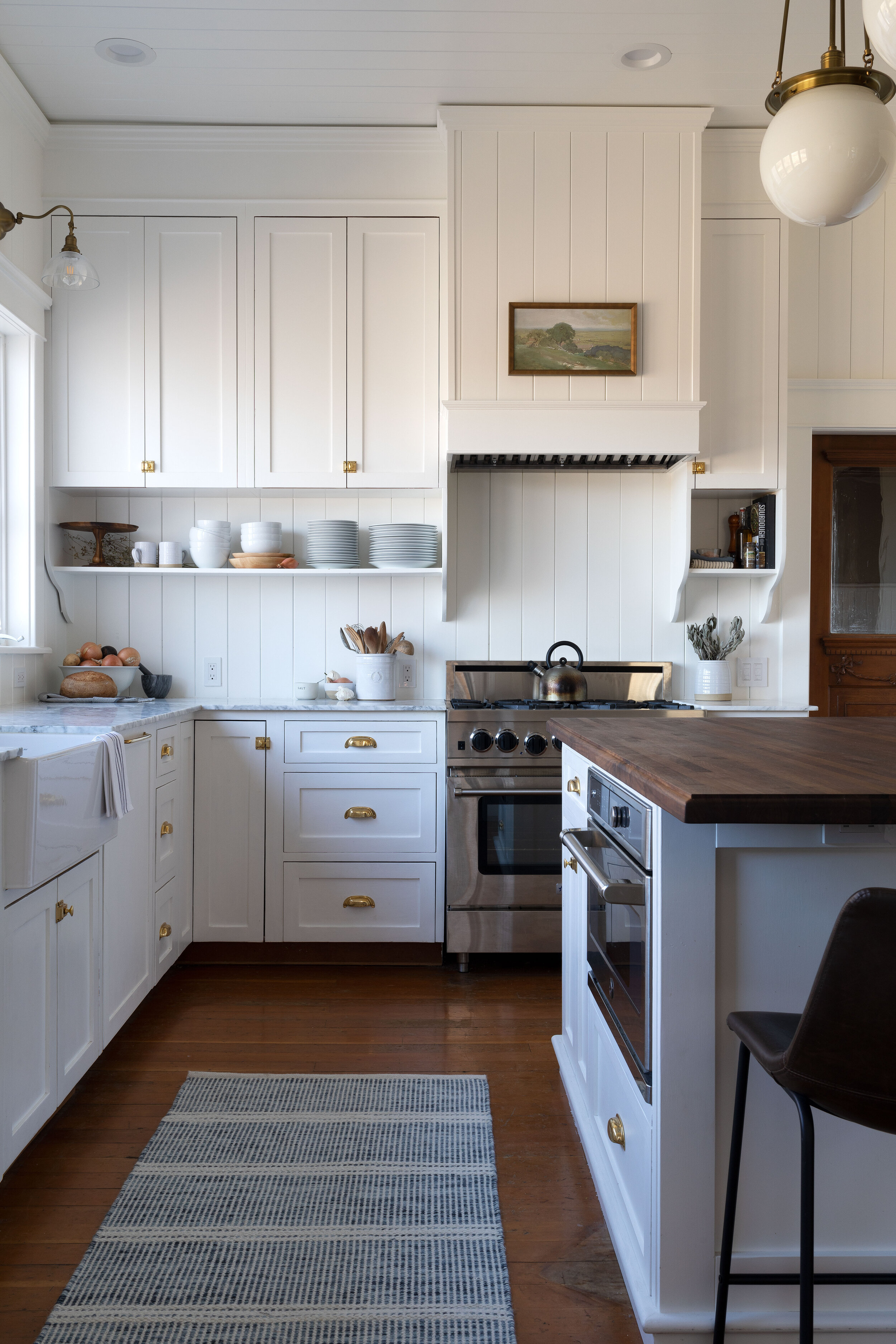 Why We Added a Backsplash To our Range (+ How the Paneling is Holding Up) —  The Grit and Polish